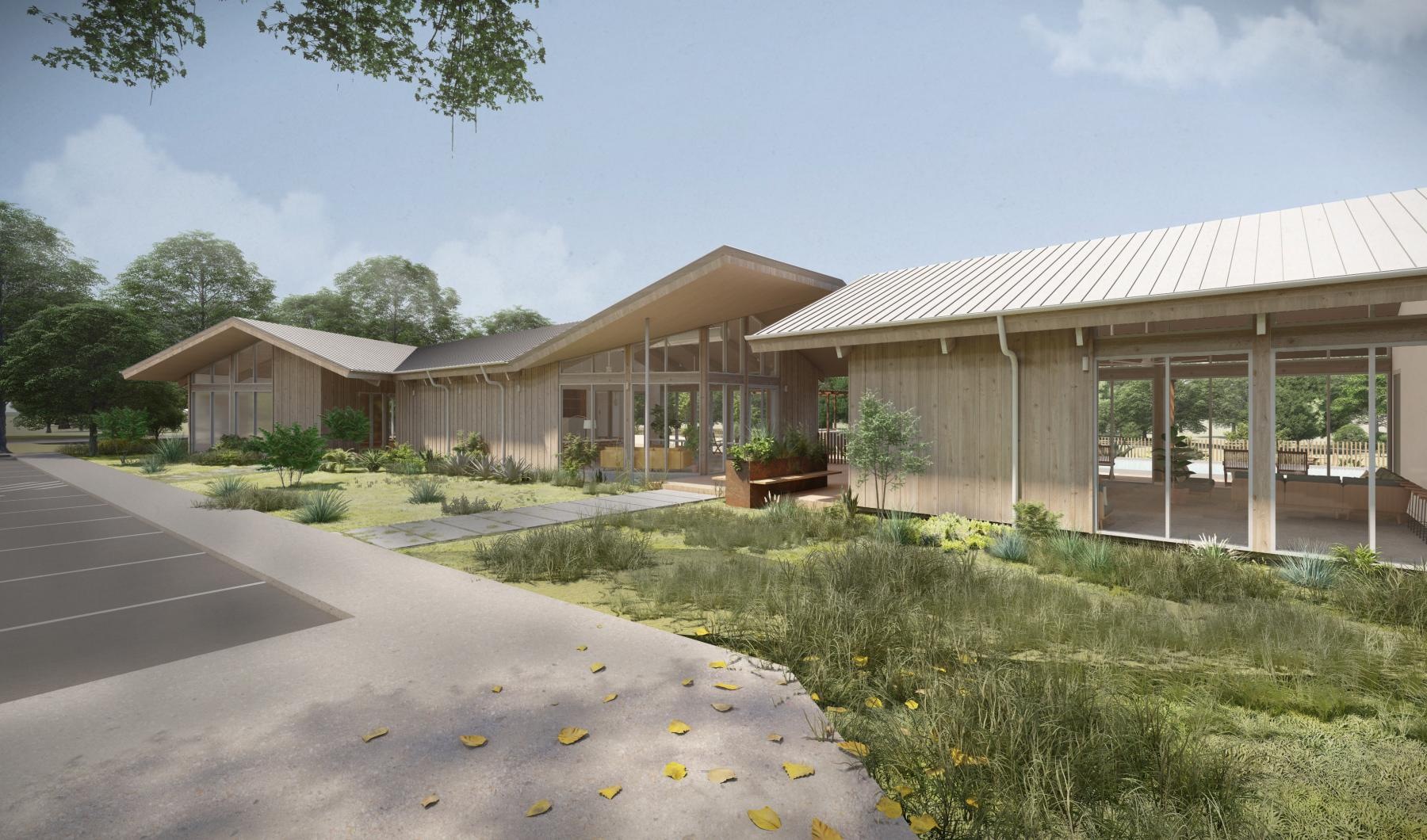 a building with a lawn and trees