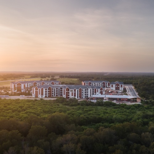 Drone shot of lush valley with Big Valley in the center at sunset