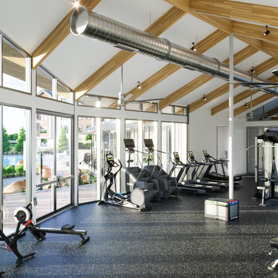 fitness center showing rowing machine, stair stepper, and treadmills with high ceilings