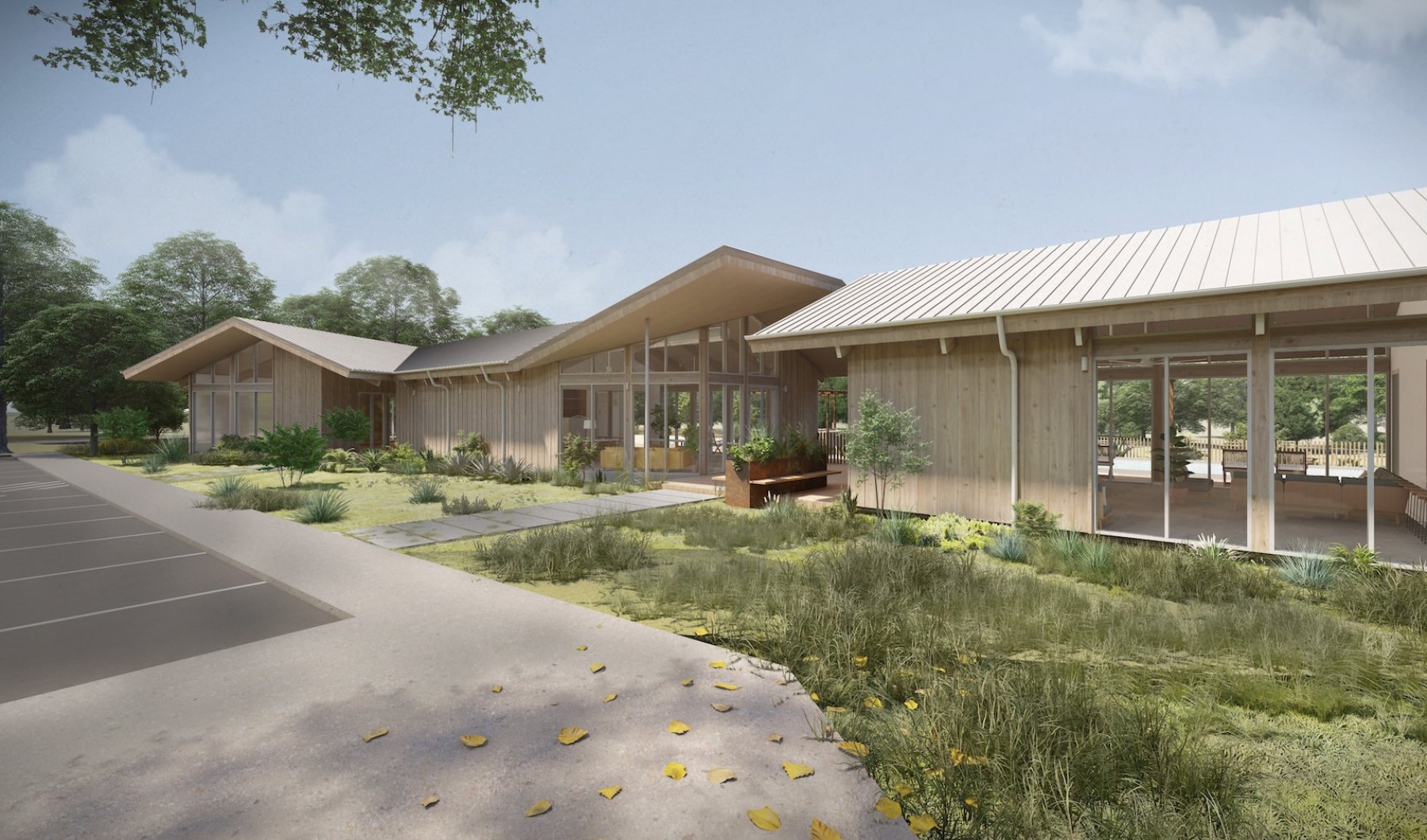 a large building with a yard and a parking lot