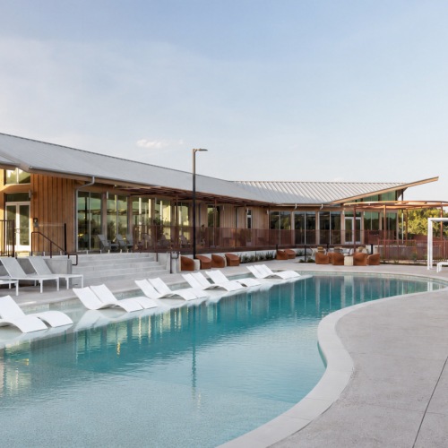 swimming pool with white lounge seaters